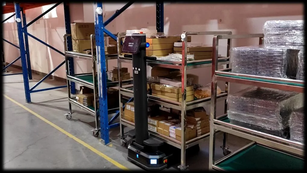 Robot moving materials in a manufacturing facility
